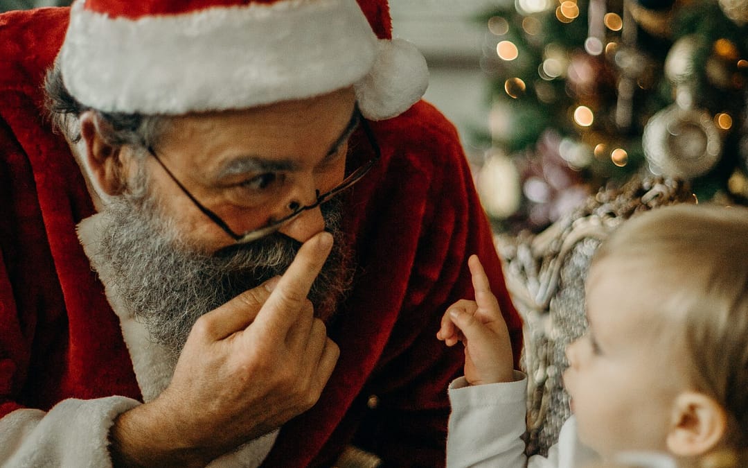 Santa wishes Merry Christmas to kids